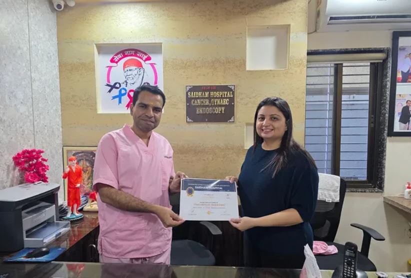 Dr Riya Choudhary receiving her FMAS Gynaec Endoscopy Fellowship certificate